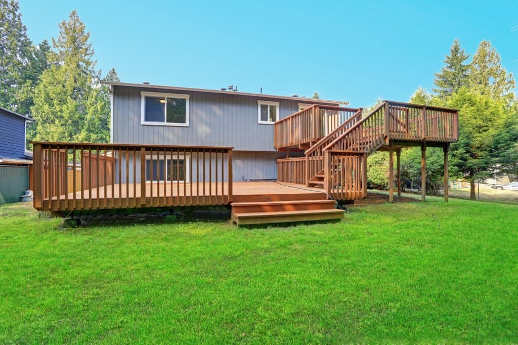 Multi-level backyard deck with stairs and railings