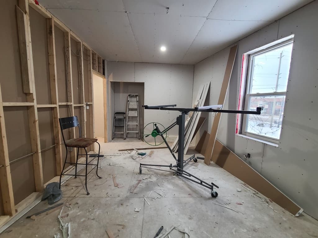 Interior drywall installation with wall and ceiling details